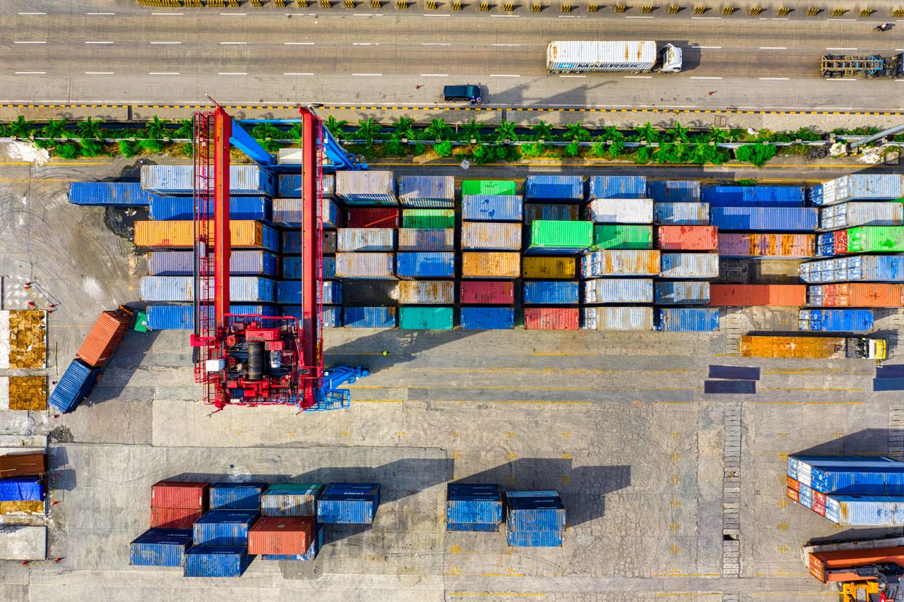 Colorful cargo containers organized at a shipping yard in North Jakarta, Indonesia.